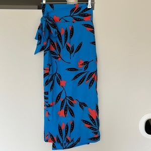 Vici wrap skirt. MIDI length. Tie through loop. Brand new.